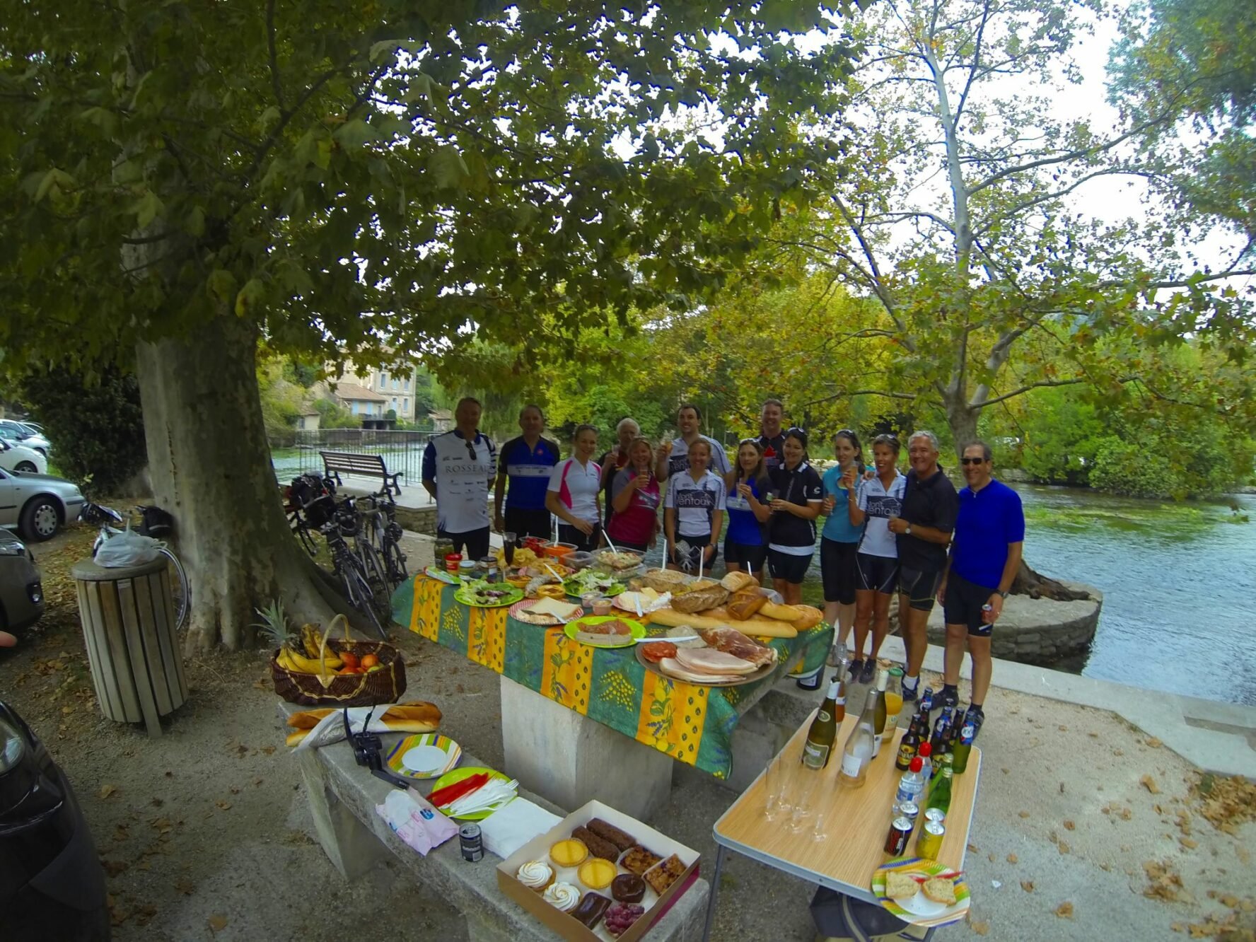 Cyclists enjoying a picnic in a Provencal village.