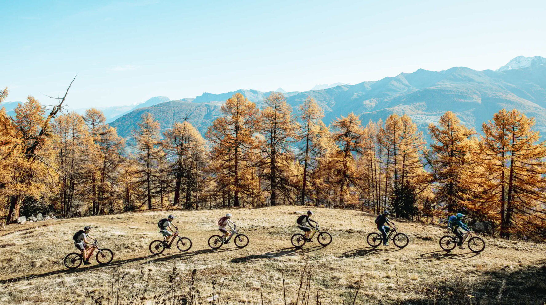 MTBers enjoying an easy trail, part of the Haute Route in the Swiss Alps.