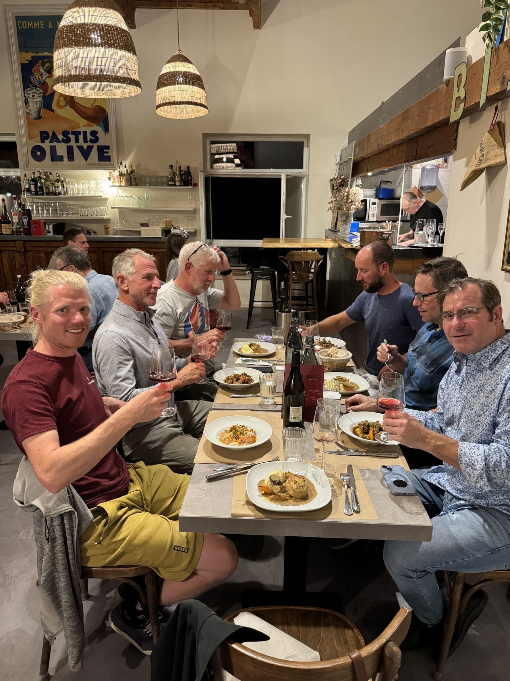 Group of cyclists having dinner in Provence