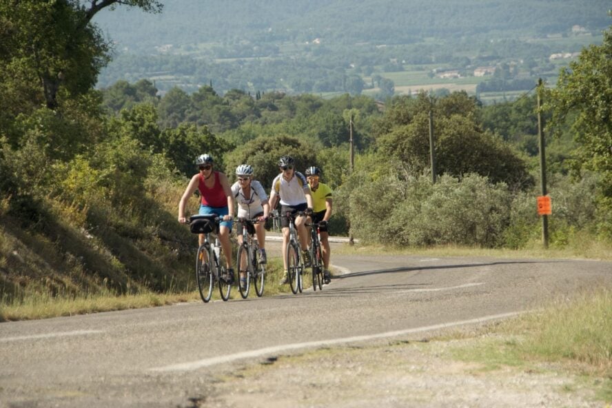 Group of cyclists on a road in Provence