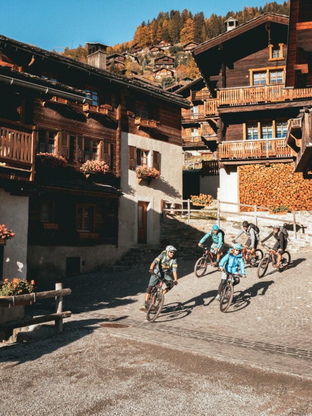 E-mountain bikers near Matterhorn, Swiss Alps.