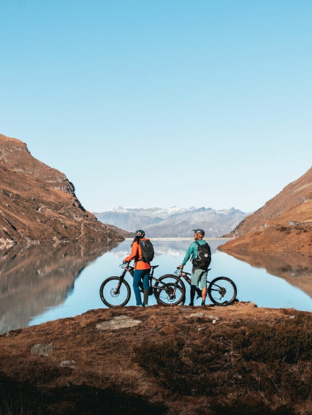 E-mountain bikers near Matterhorn, Swiss Alps.