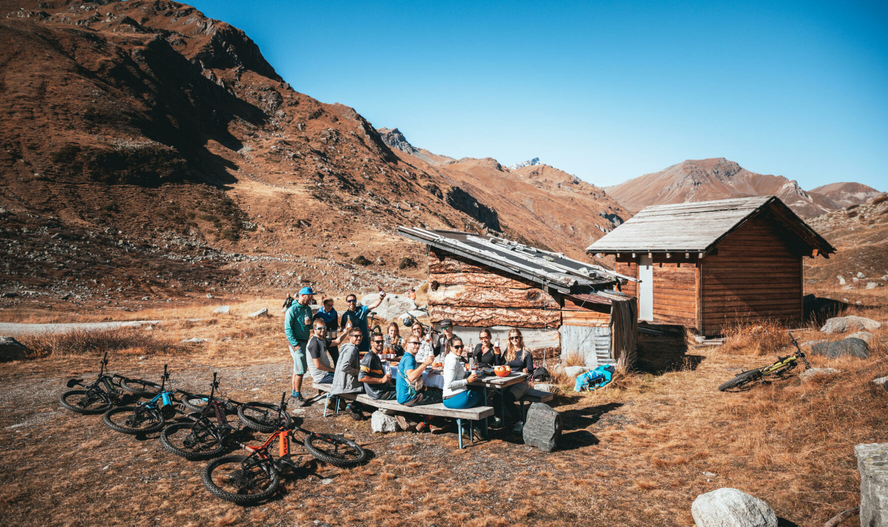 MTBers enjoying a picnic in the Swiss Alps.