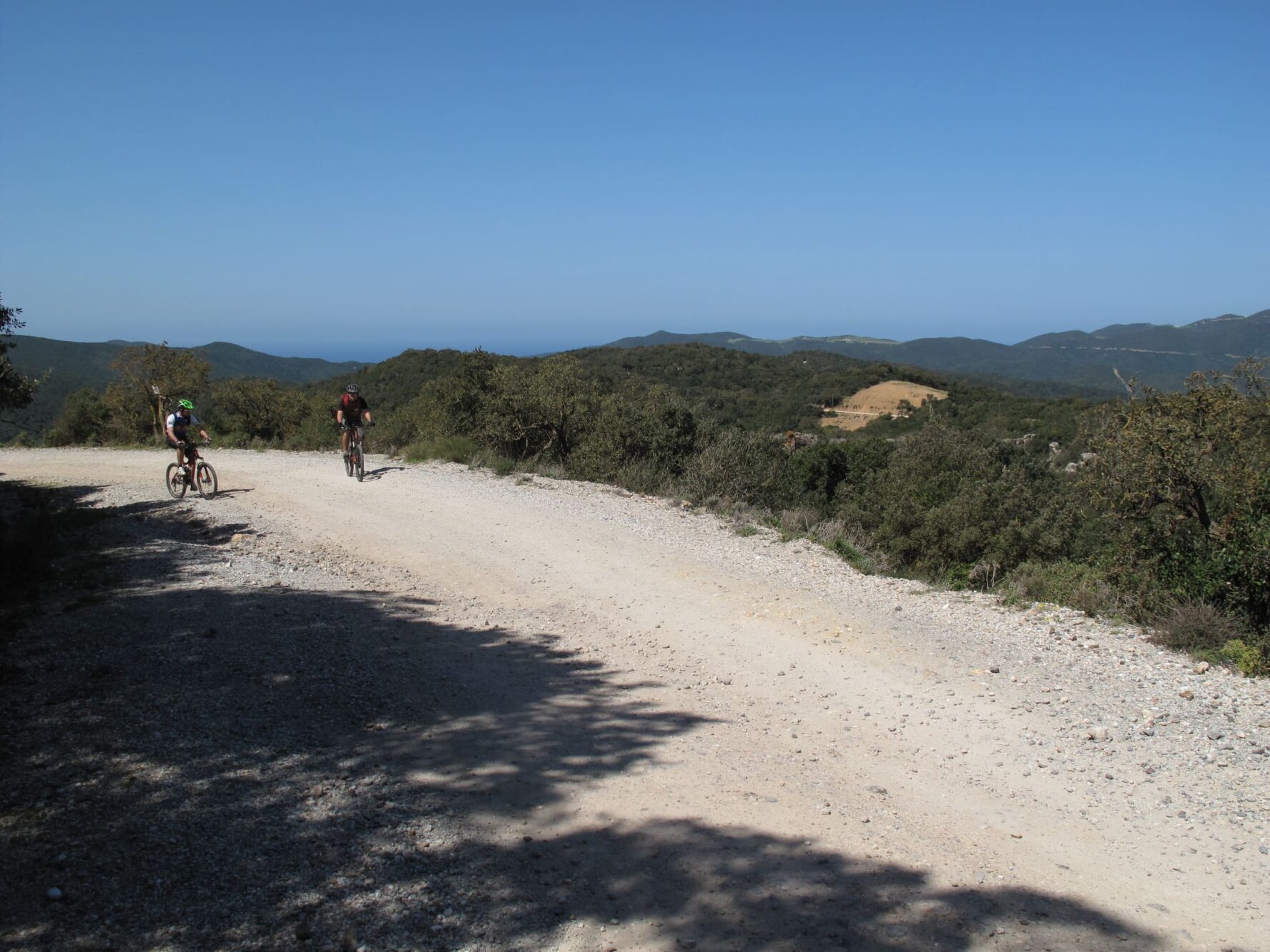 Sardinian countryside and cyclists on a sunny day