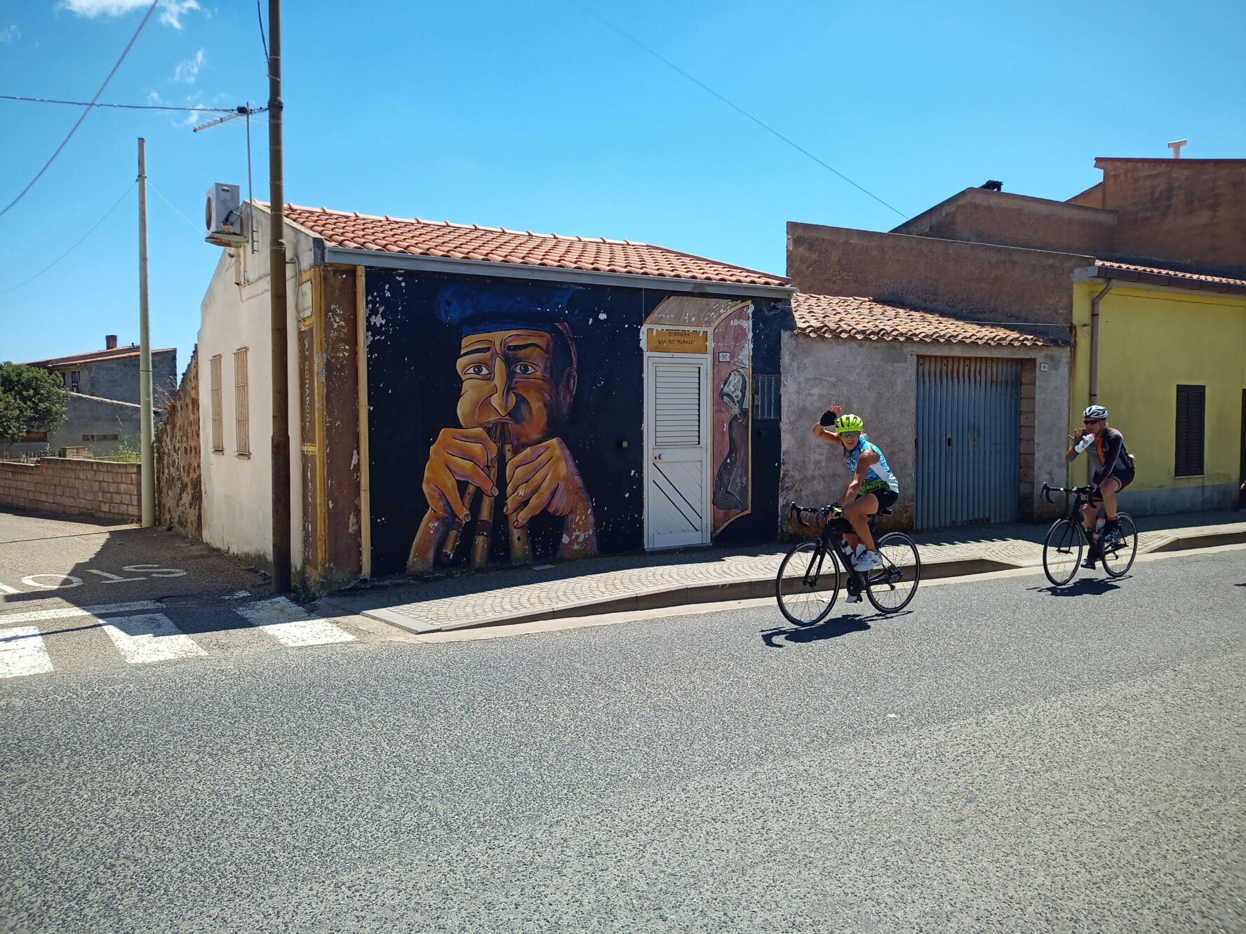 Sardinian town and cyclists