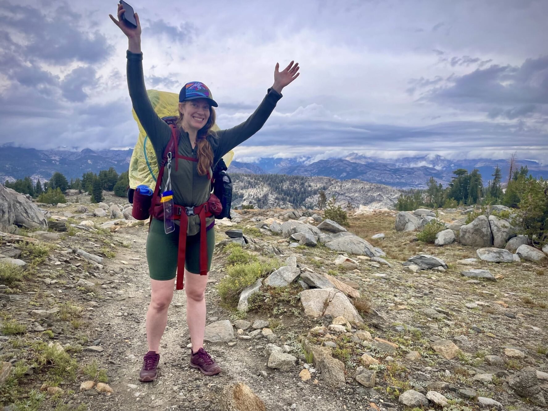 Happy hiker with hands up in Yosemite