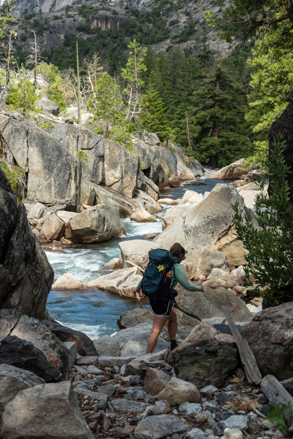 Hiker with a large backpack hiking in Yosemite.
