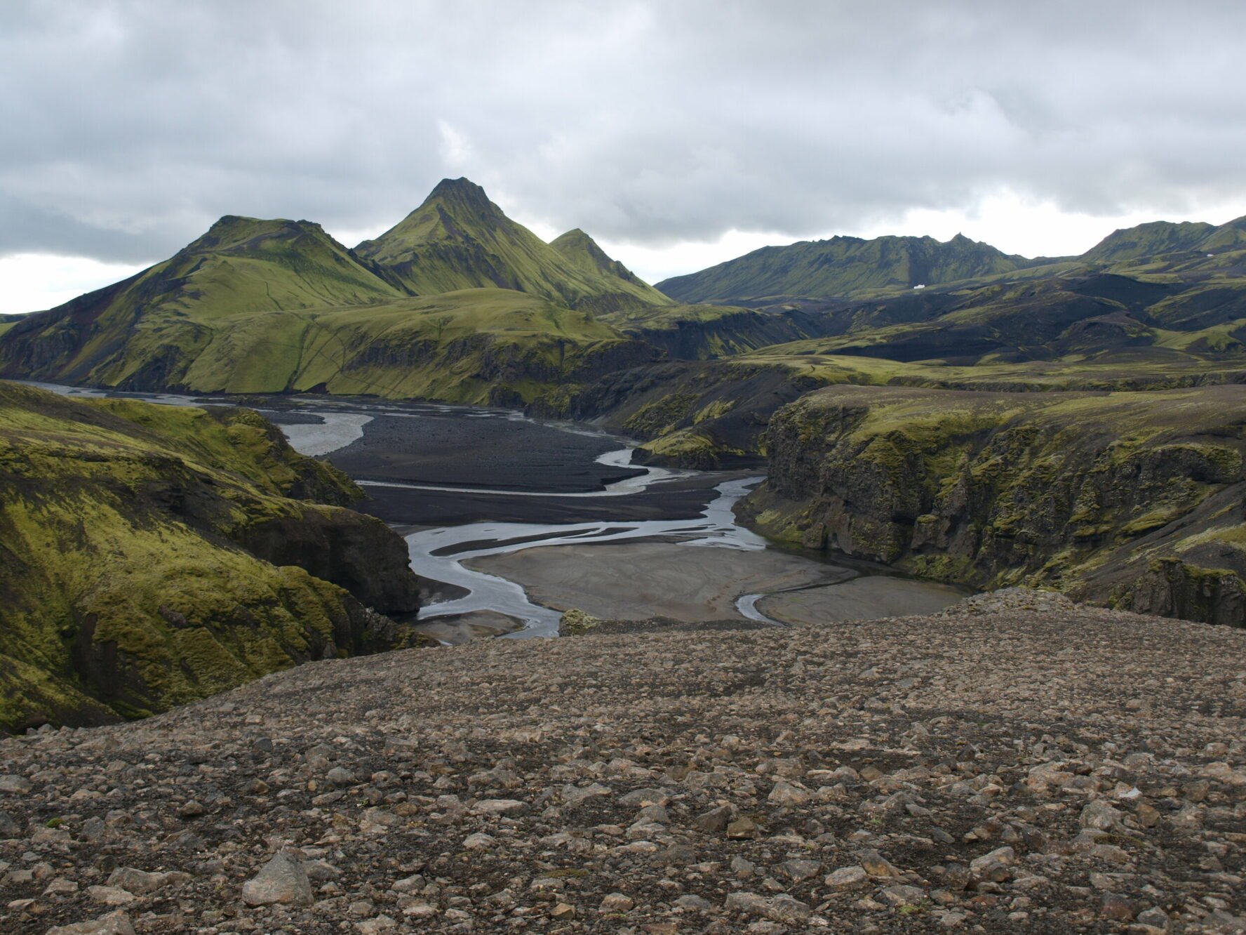 Hvanngil valley with a mossy mountain and a braided river, in the Icelandic Highlands.