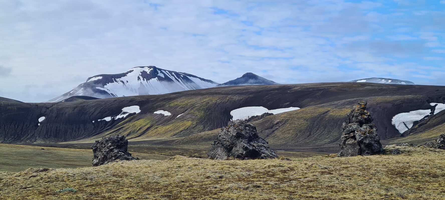Snow-patched mountains in Iceland.