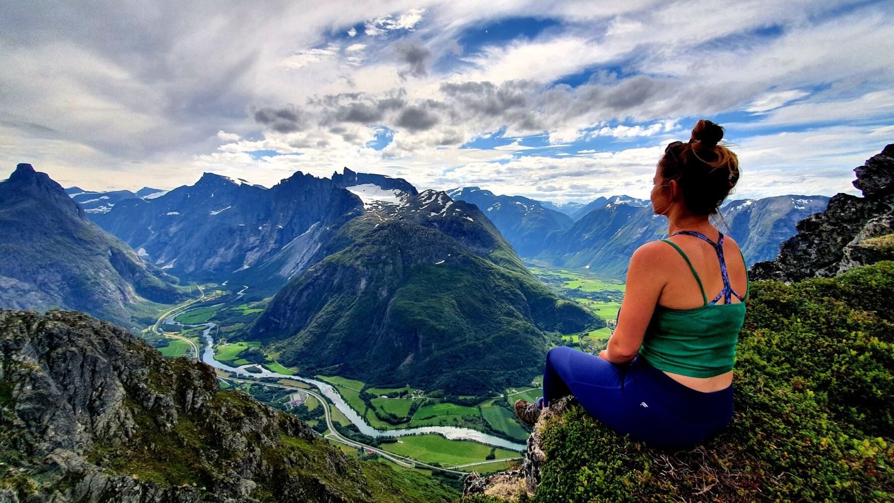 Woman hiker relaxing on a mountain in Norway