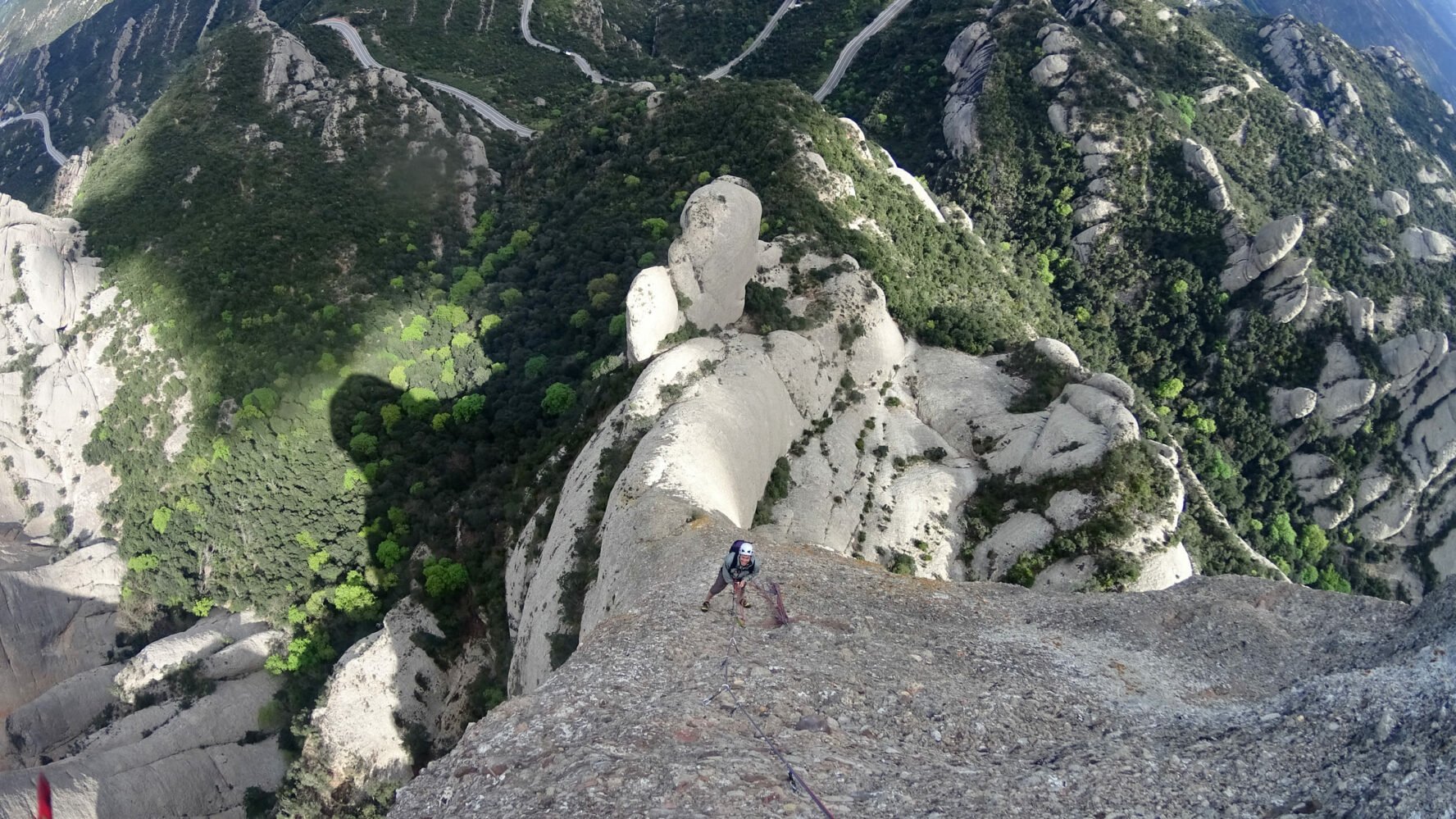 Climber scaling the Catalonia mountains
