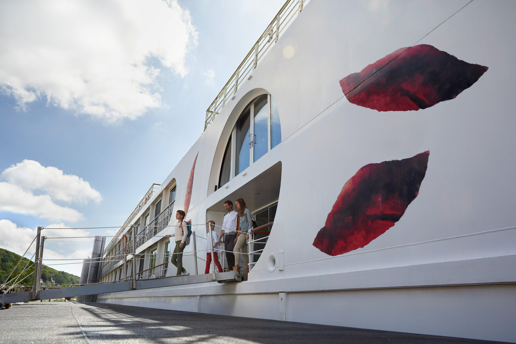 Family disembarking a river cruise