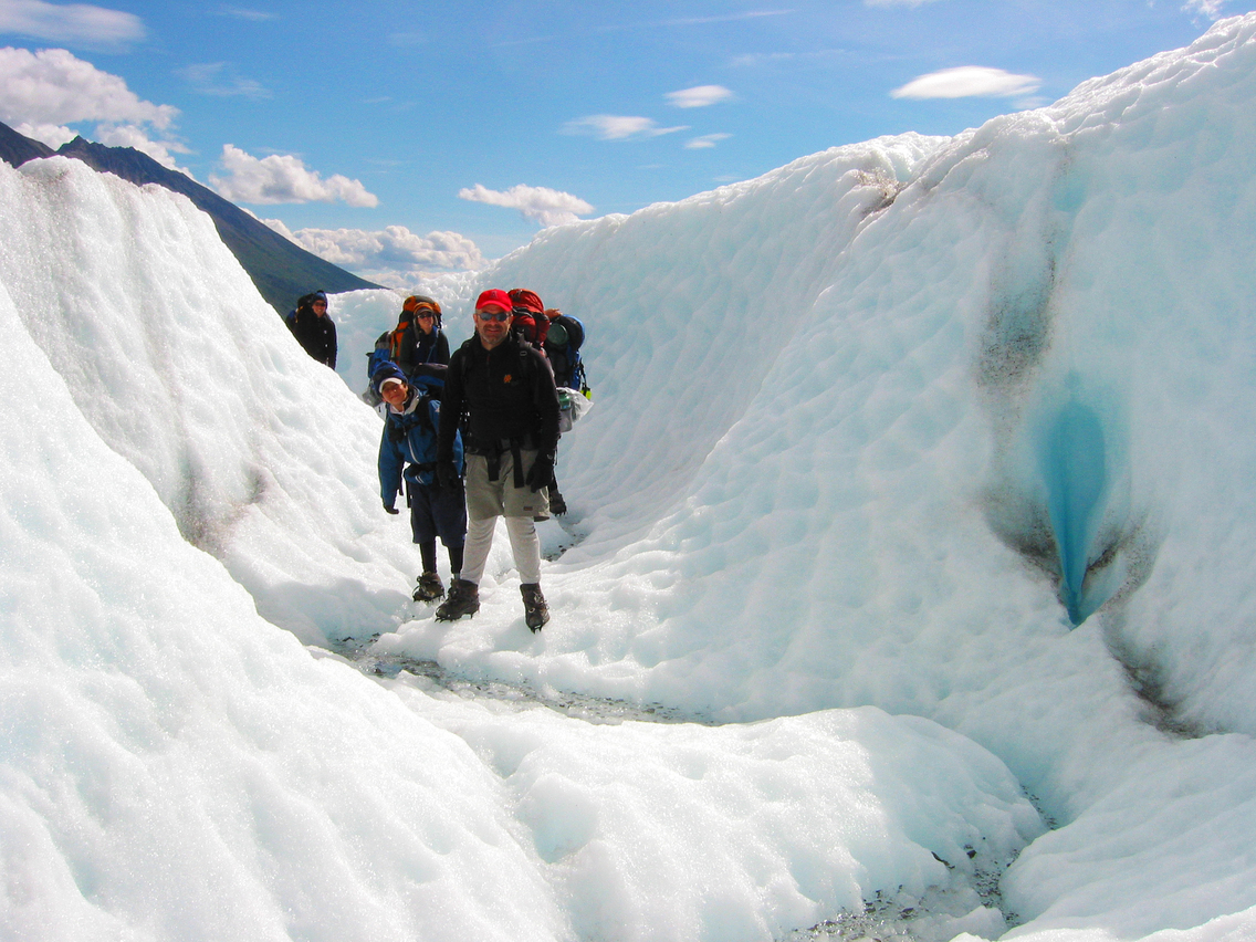 Family traversing the Root Glacier
