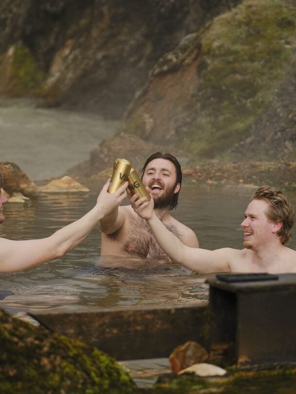 group hikers in hot pools in iceland