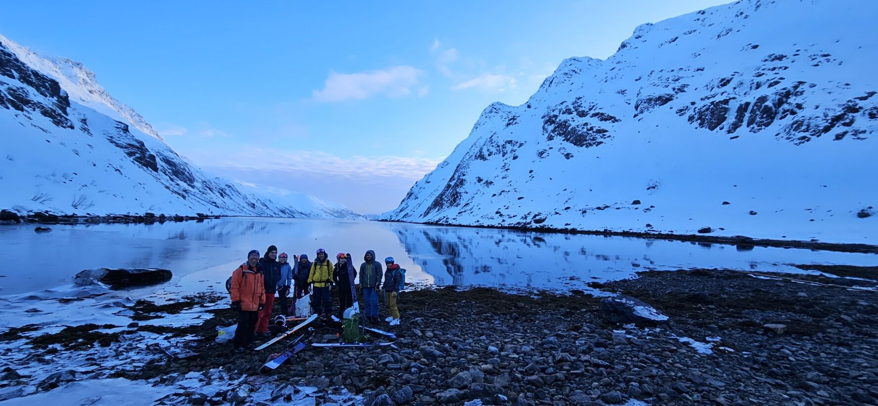 Group of skiers in Norwegian fjord