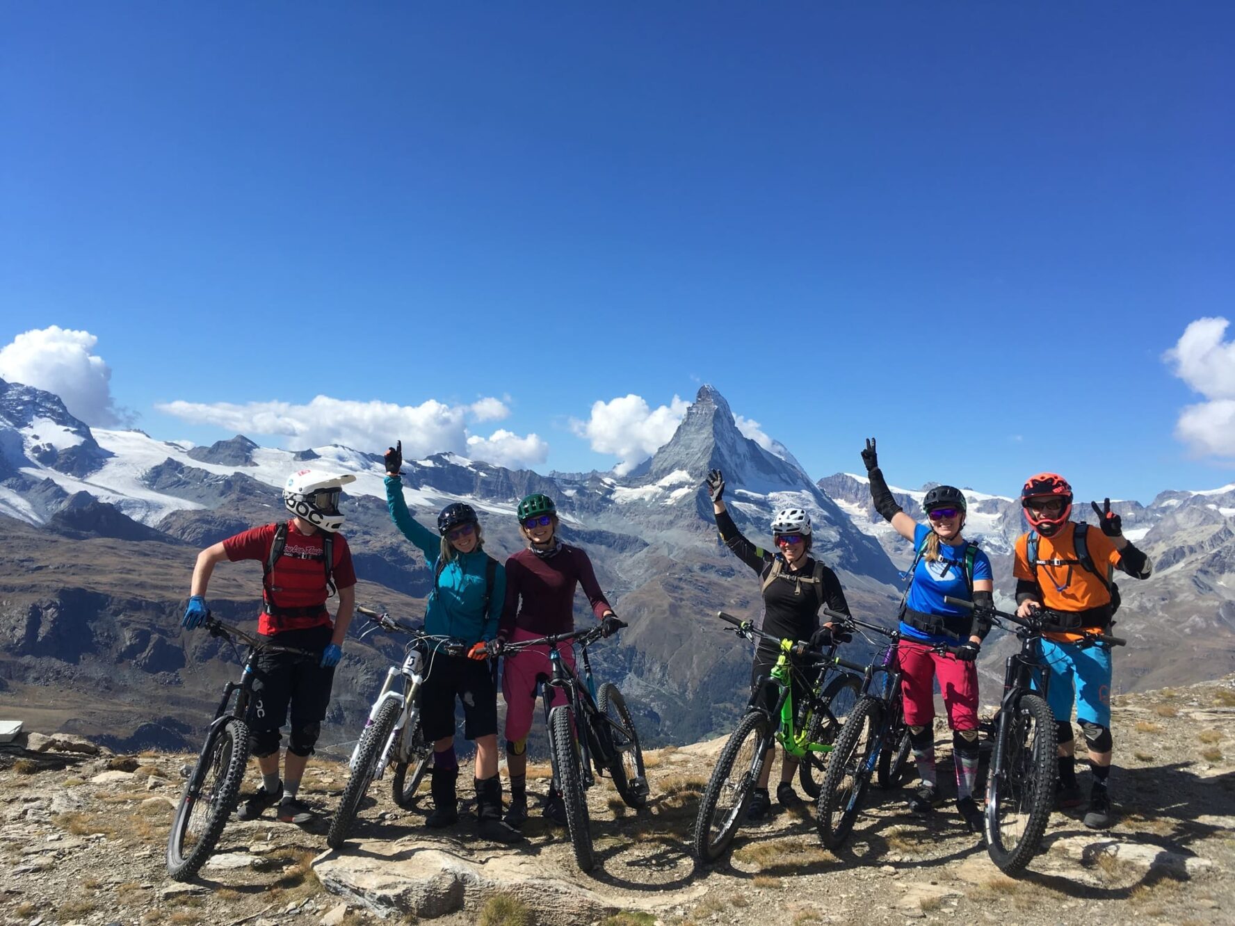 Happy group of mountain bikers in the alps