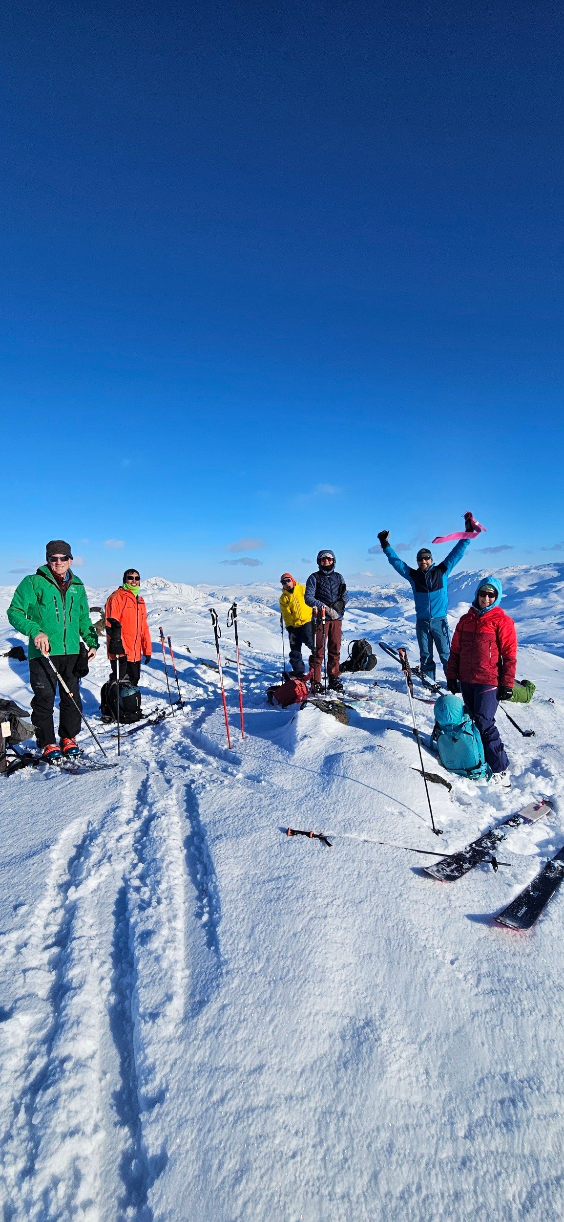 Happy skiers and Norway fjords near Seiland