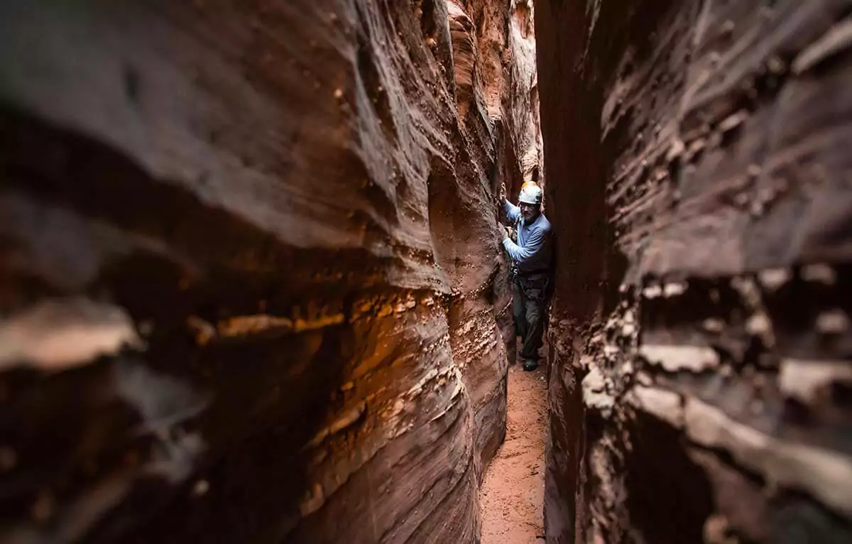 Hiker in a slot canyon in Utah