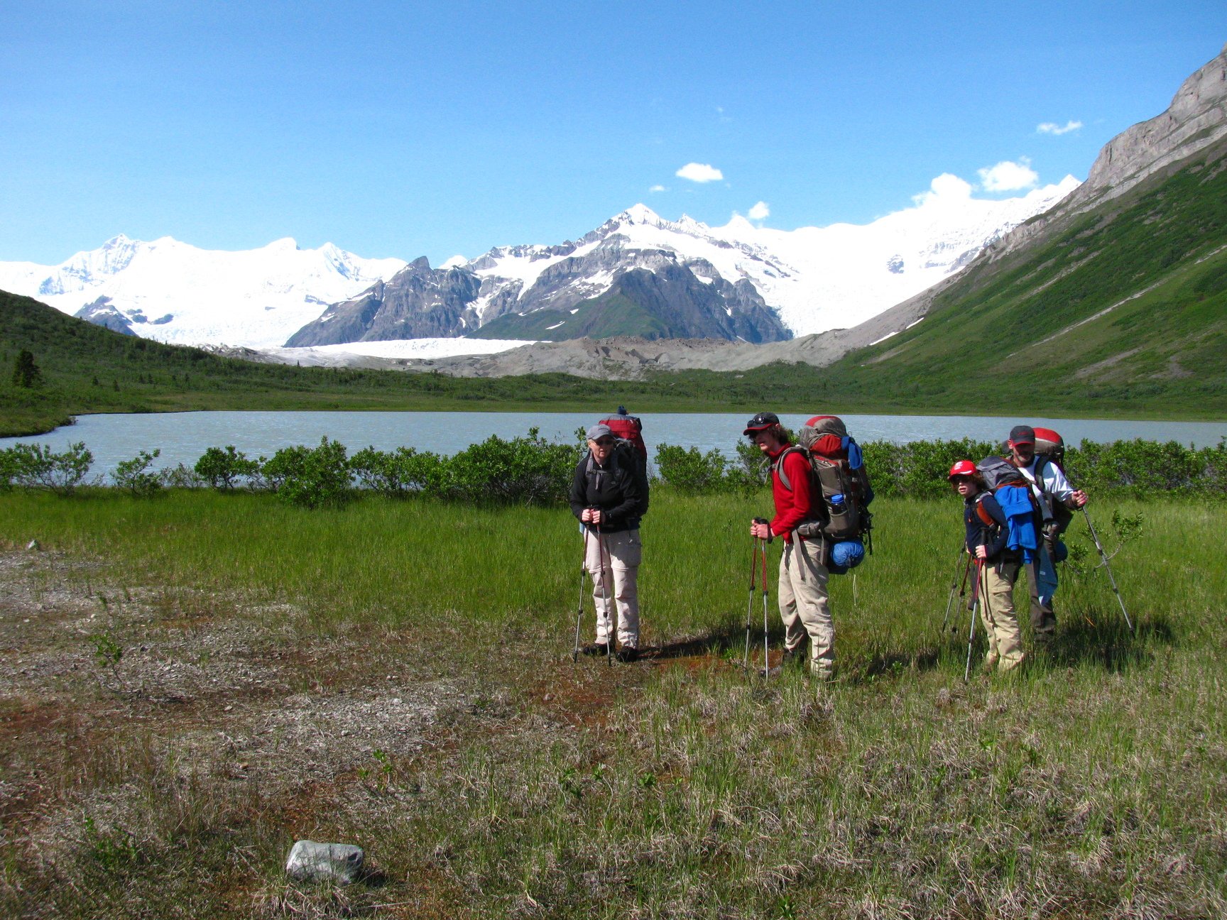 Hikers under the Wrangell range in Alaska