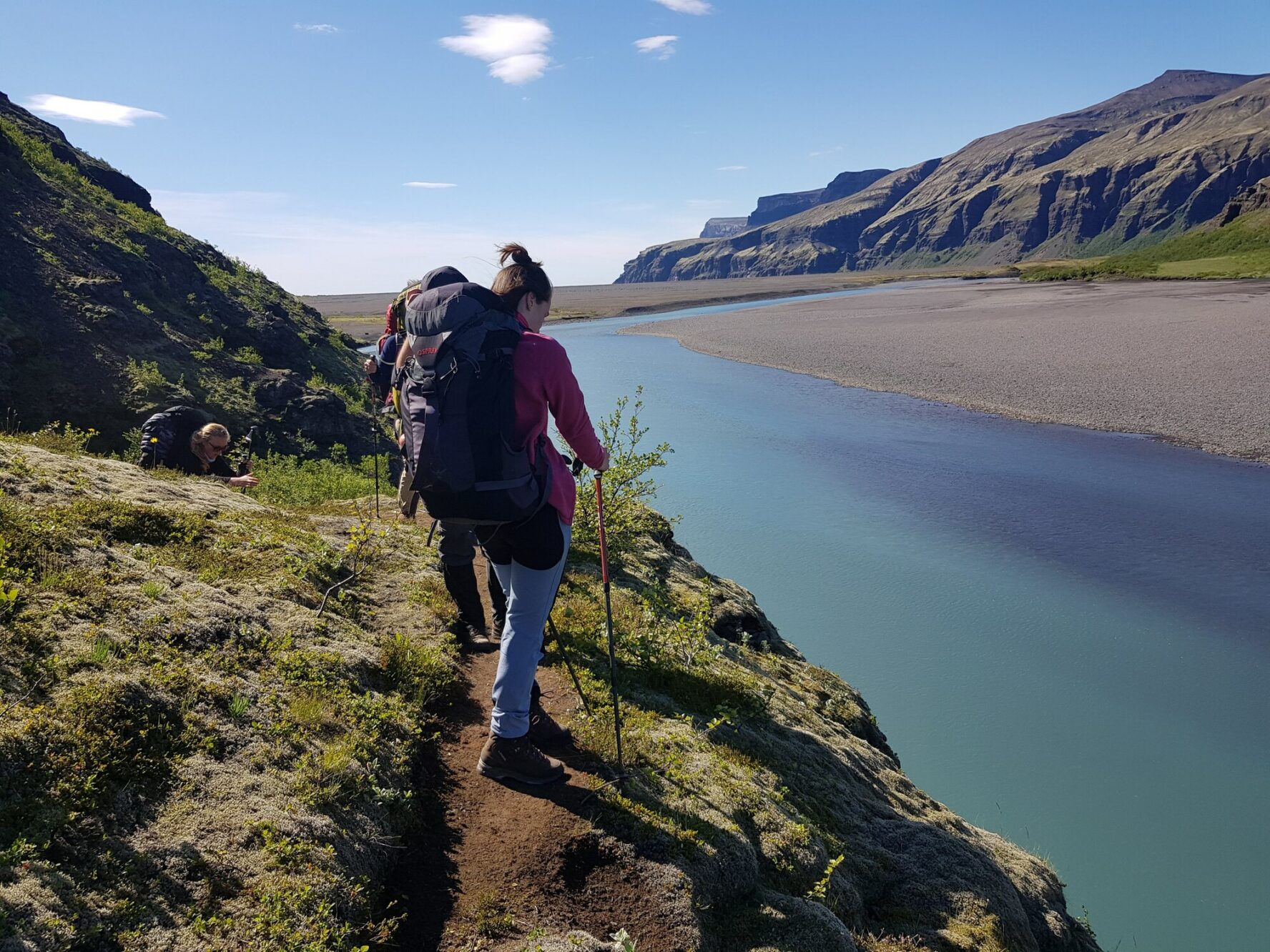 Hikers near a lake in Iceland.