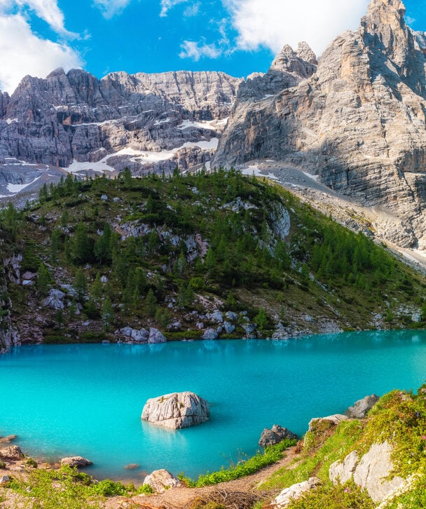 Hiker near Torre Grande in the Dolomites.