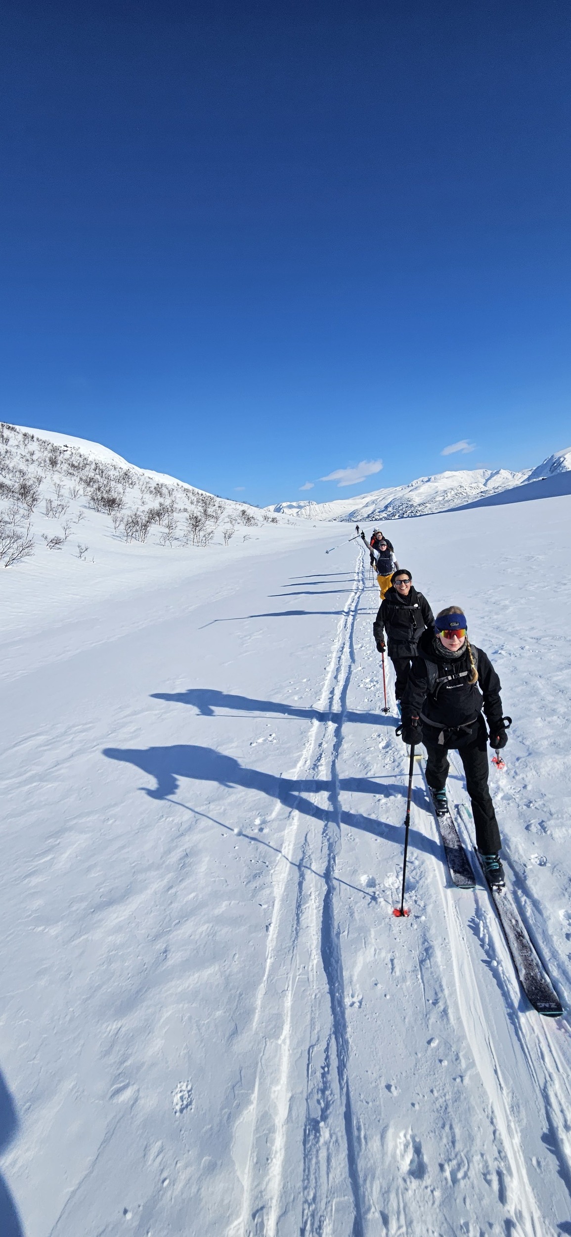 Line of skiers in Norway on slopes