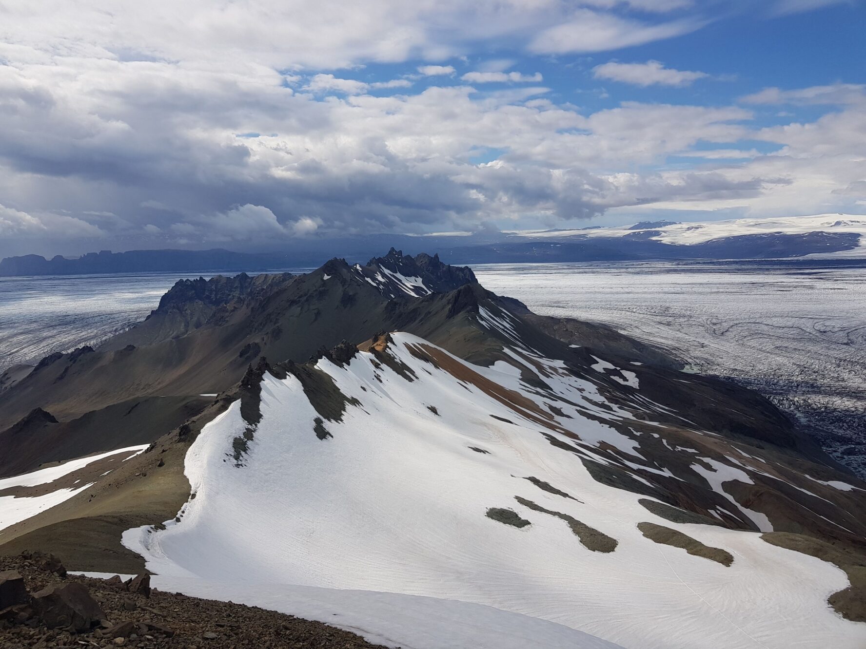 Summit of a mountain and a glacier beneath, in the Icelandic Highlands.