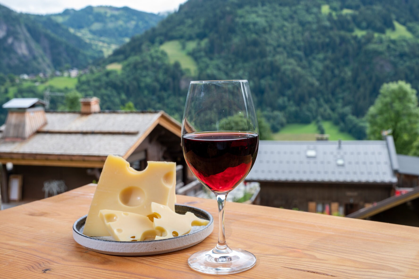 Swiss cheeses and a glass of red wine.