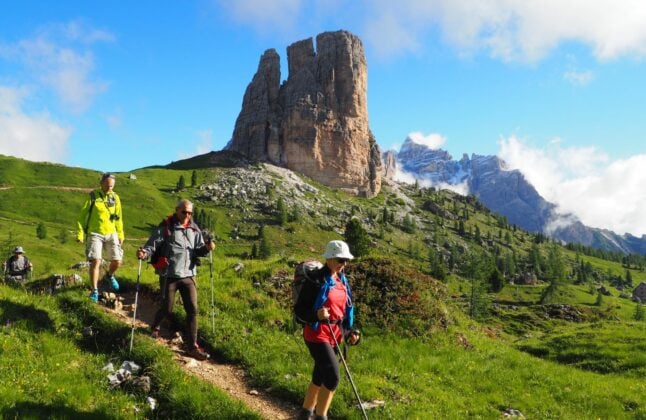 Hiker near Torre Grande in the Dolomites.