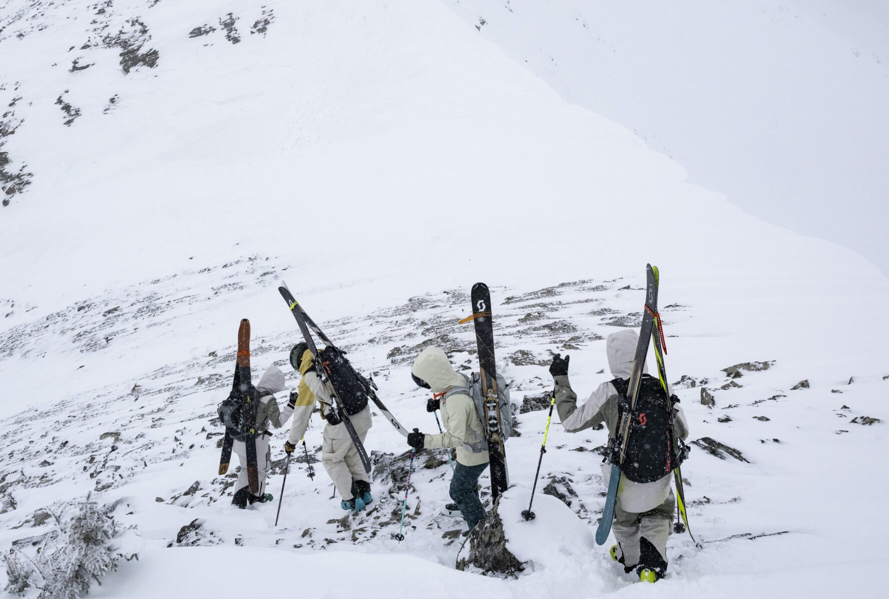 A group of backcountry skiers approaching their next ski run, near Purcell Mountain Lodge.