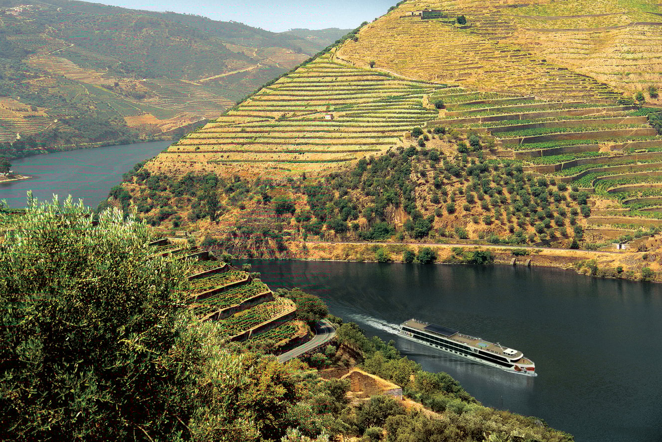 Cruising by terraced vineyards on the banks of the Douro River