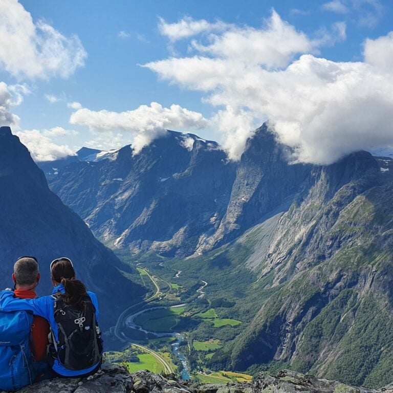 Hikers admiring Norwegian mountains