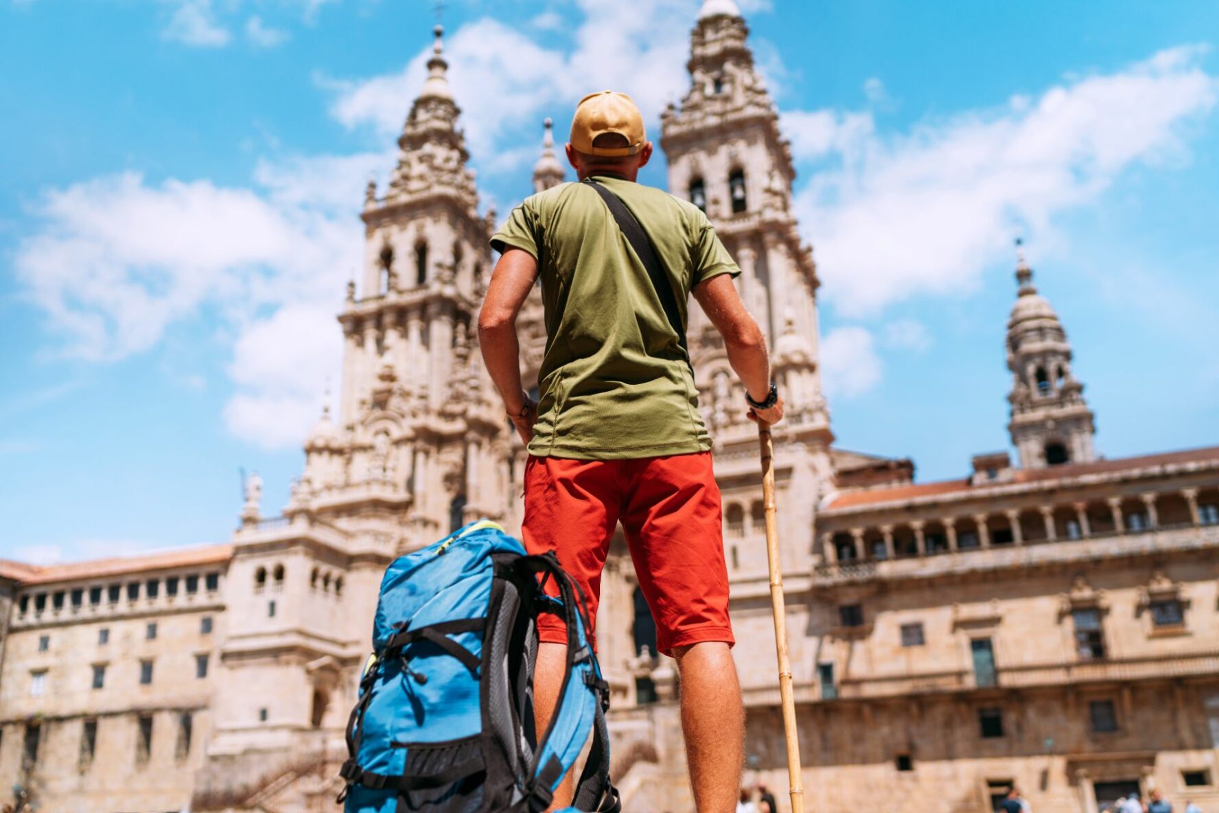 Pilgrim in front of the cathedral in Santiago de Compostela.