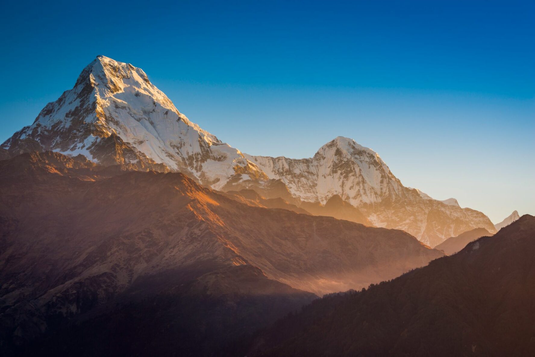 Sunrise over snow-capped Annapurna peaks.