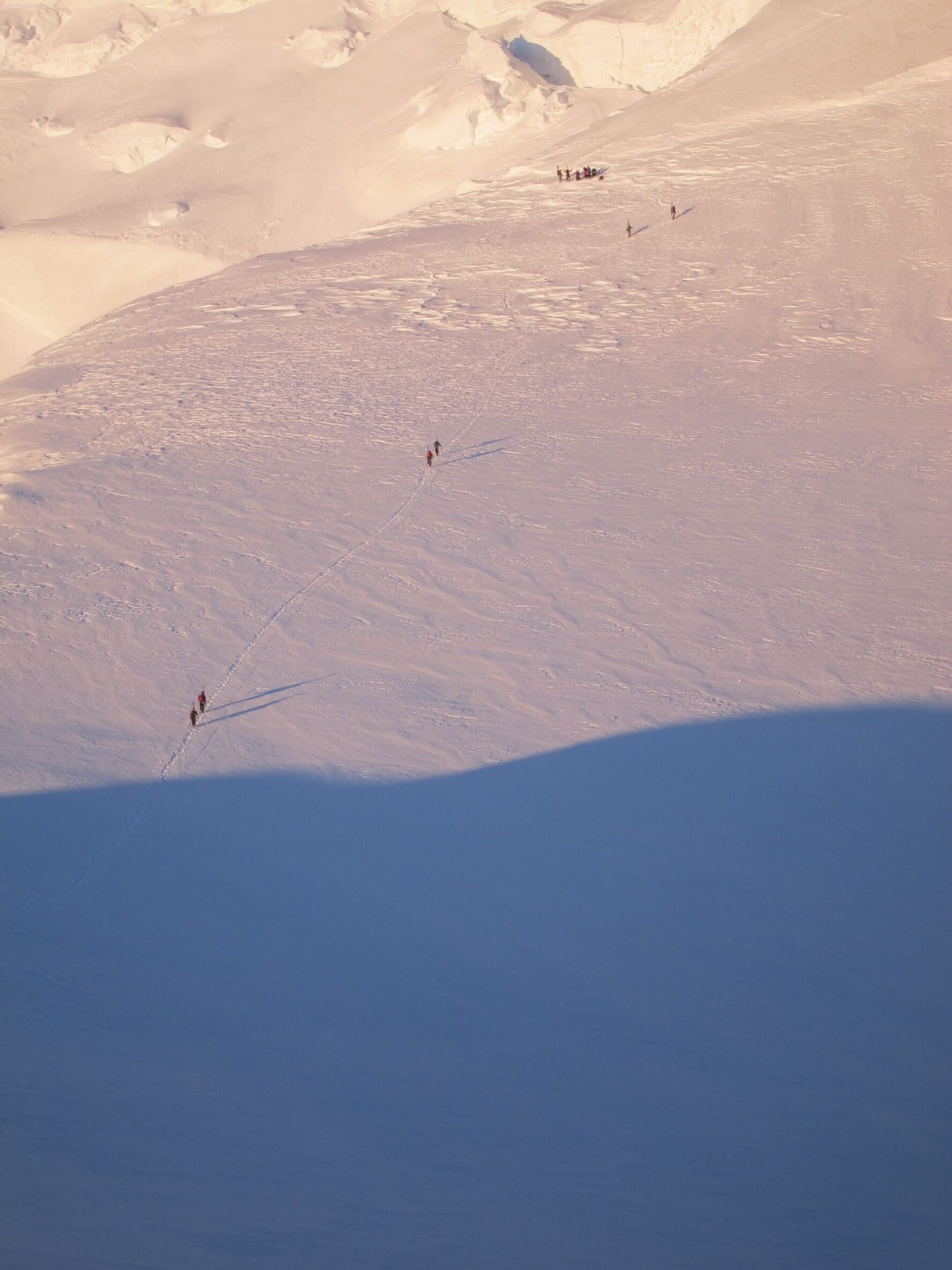Tiny people climbing in the Alps