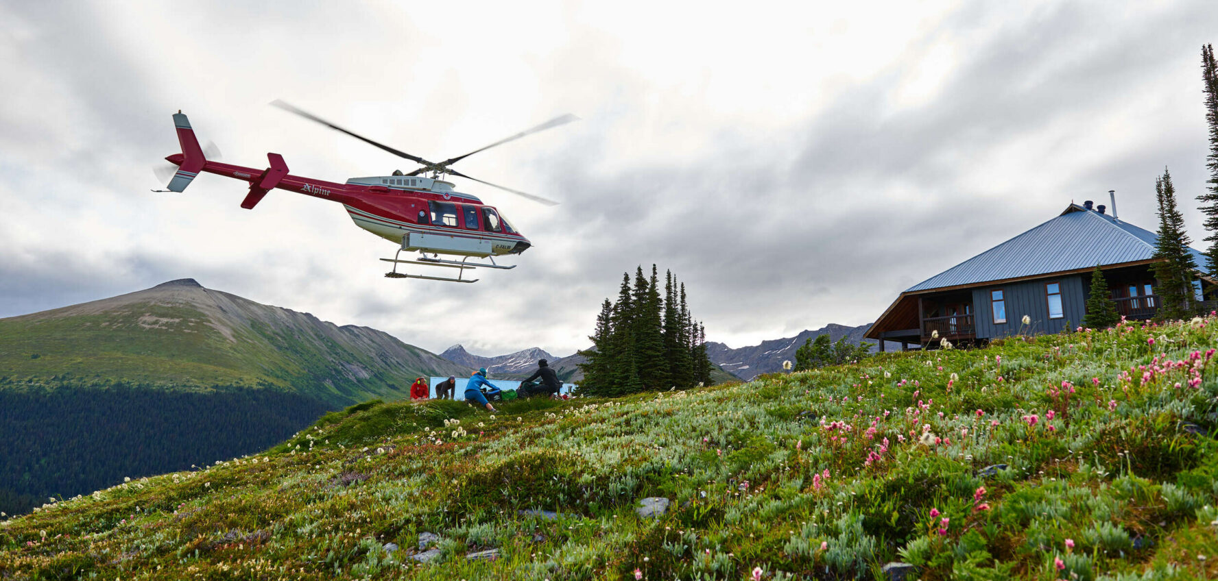 Helicopter landing beside the Purcell Mountain Lodge.