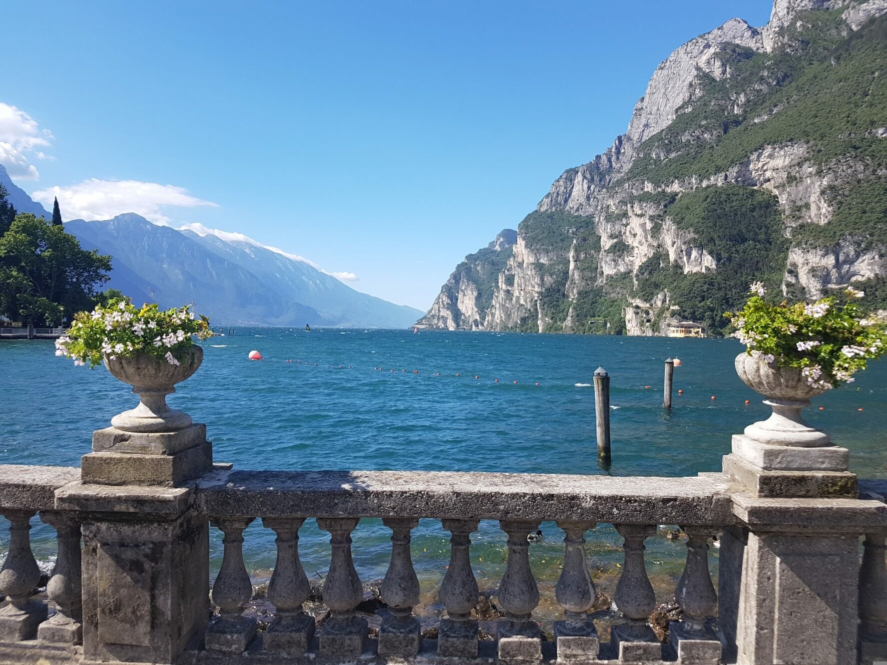 Lake Como shoreline promenade with a nice stone fence and gorgeous lake and mountain views.