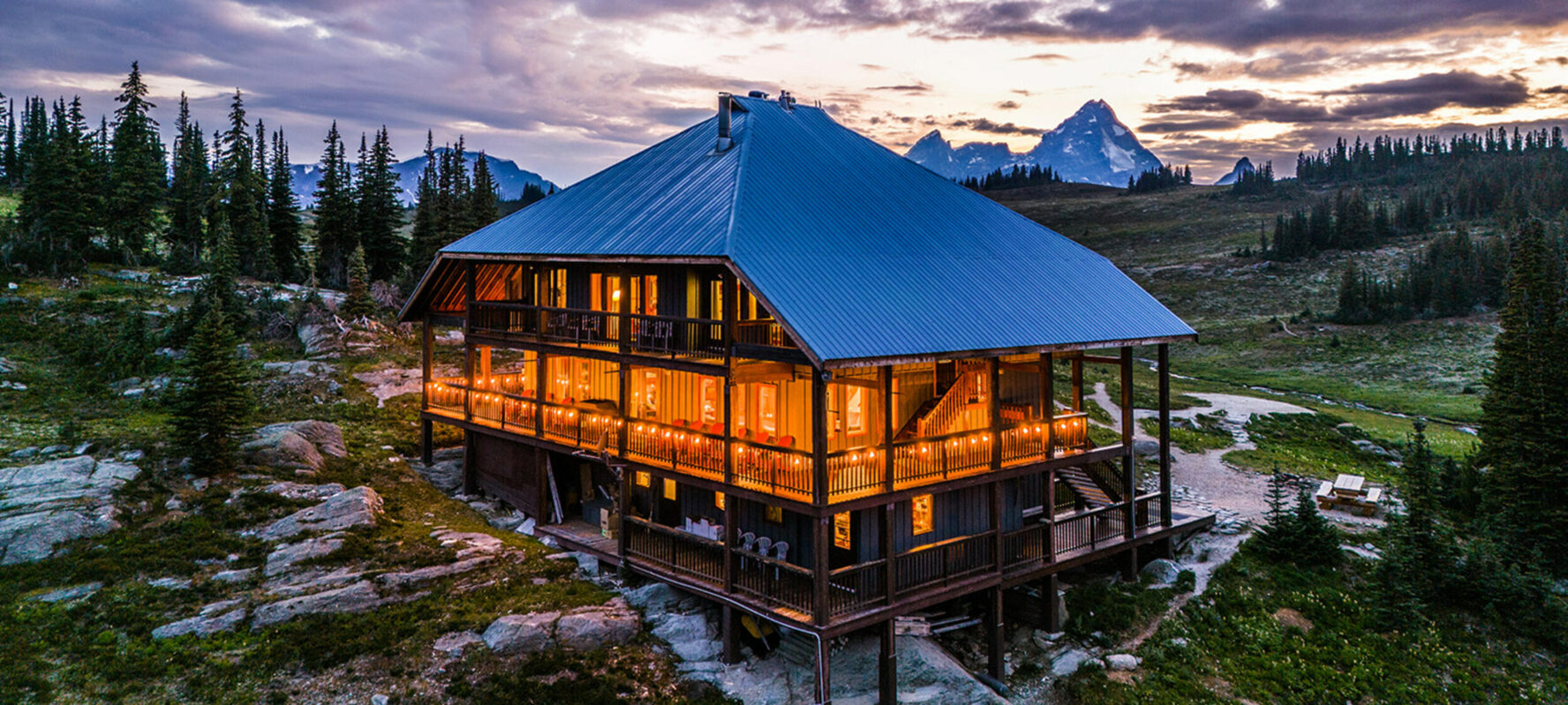 Purcell Mountain Lodge at dusk, during summer.