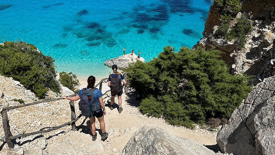 Crystal clear sea and hikers in Sardinia