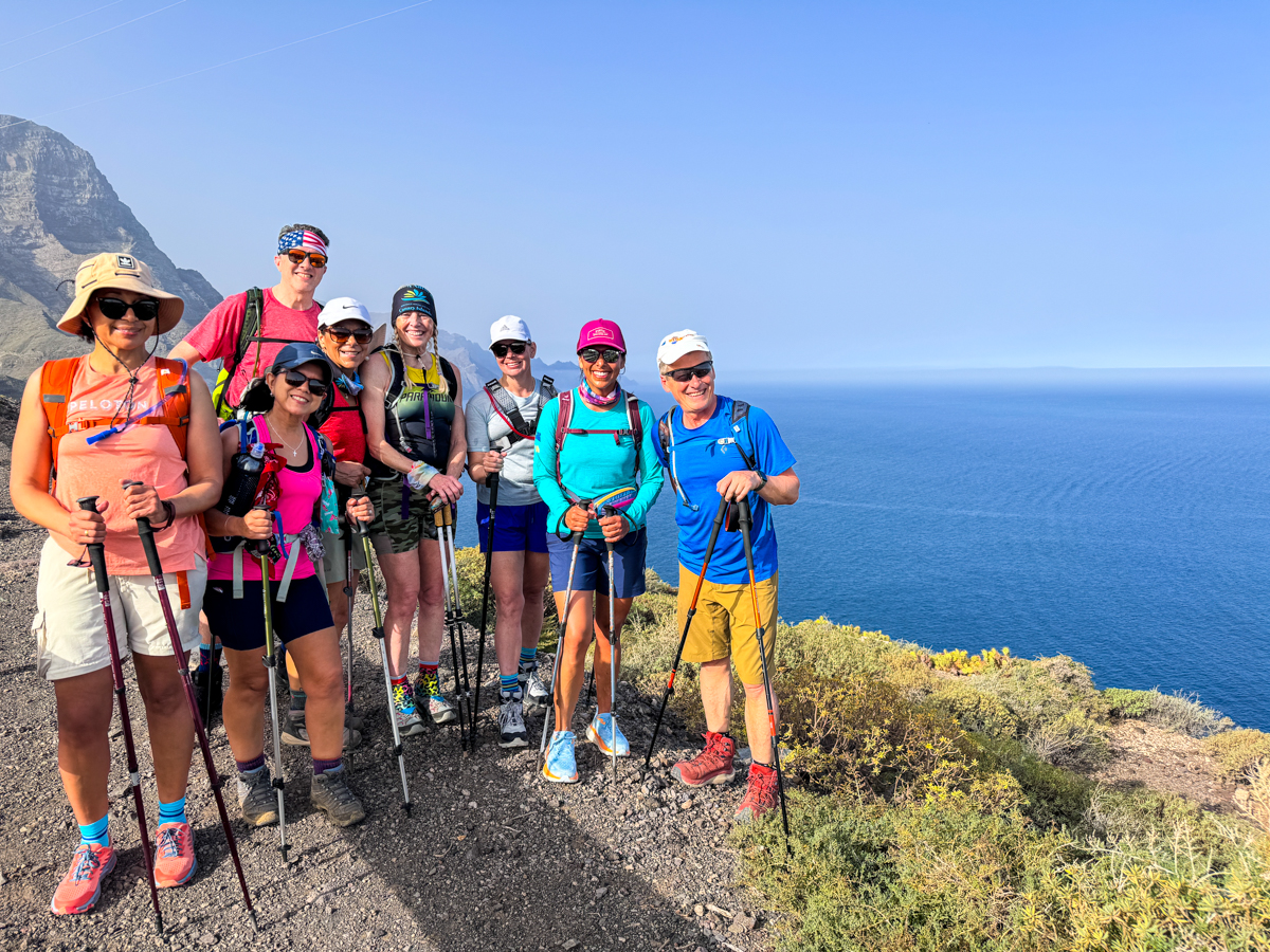 Group of happy hikers above sea, Gran Canaria