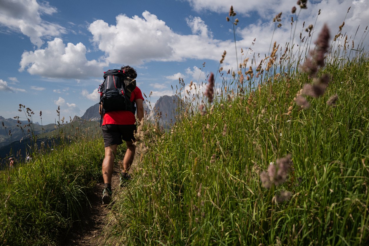 Hiker in the Dolomites in the summer