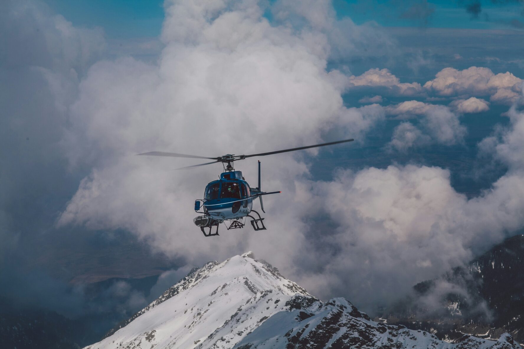 Helicopter flying beside Mount Everest.