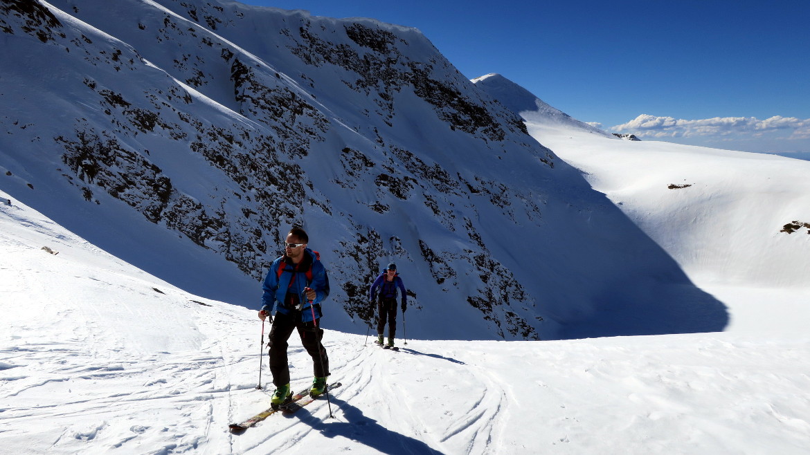 Rila Lakes in Bulgaria, two skiers