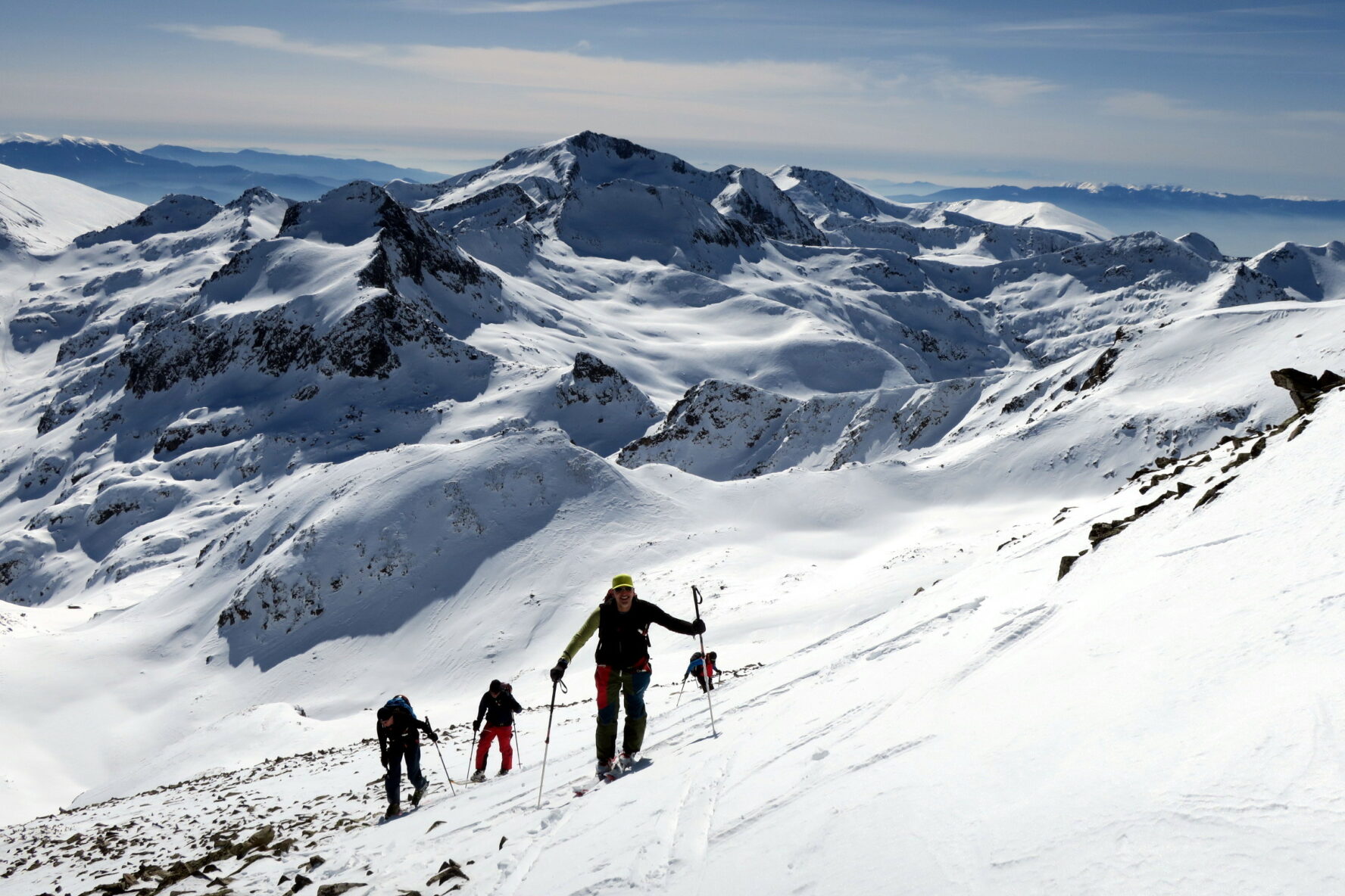 Rugged Bulgarian mountains and skiers