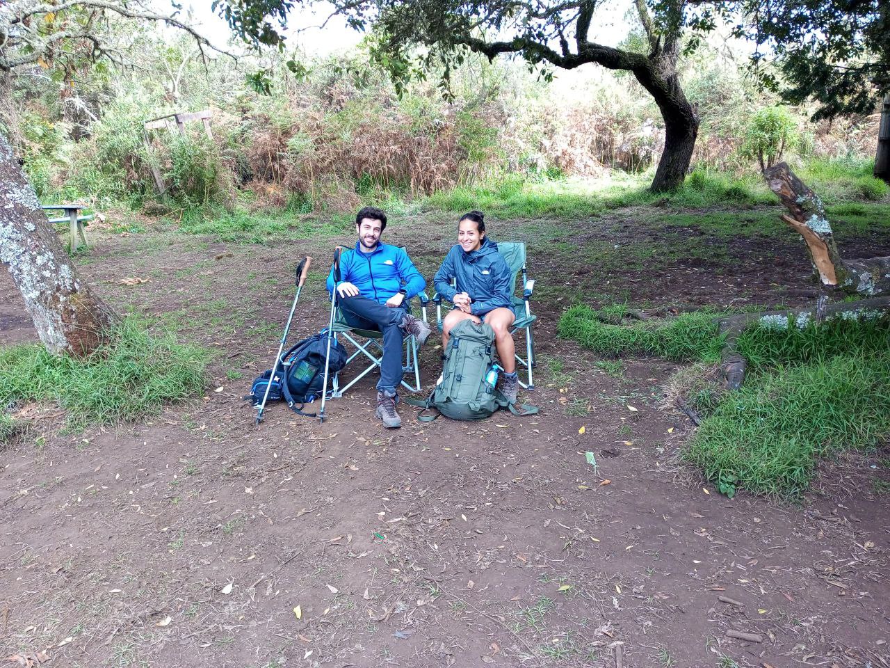 Trekkers taking a much needed break in the shade of a tree