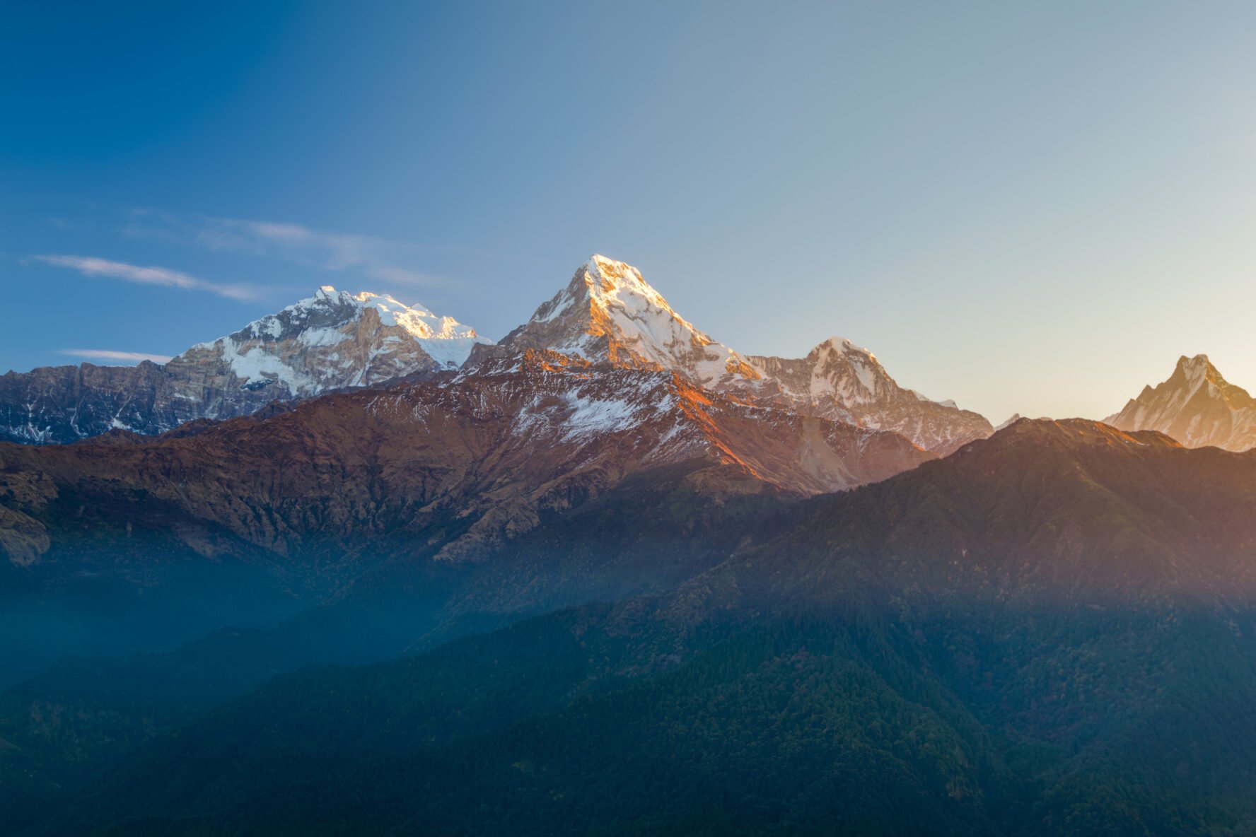 Snow-capped Himalayan peaks seen at Ponn Hill, illuminated by the first rays of sunshine.