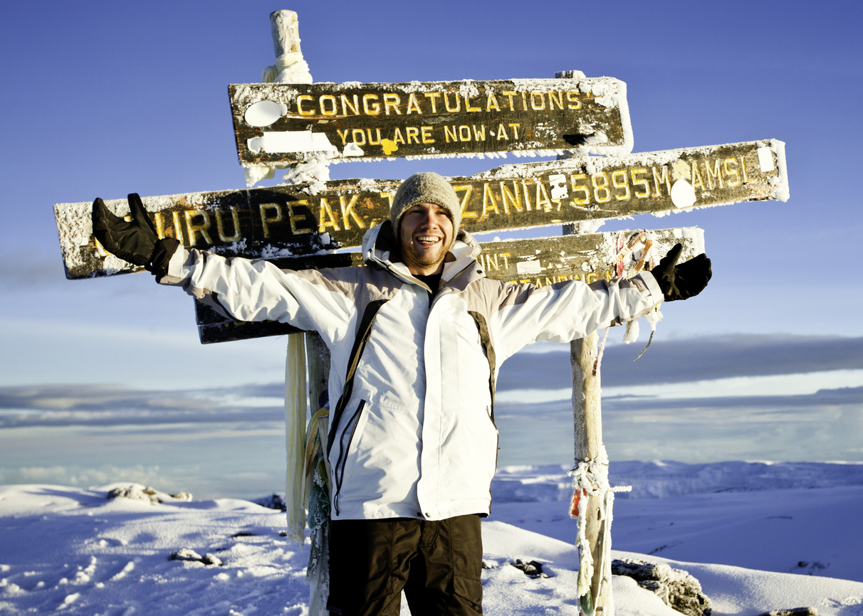 Climber at the Top of Mount Kilimanjaro