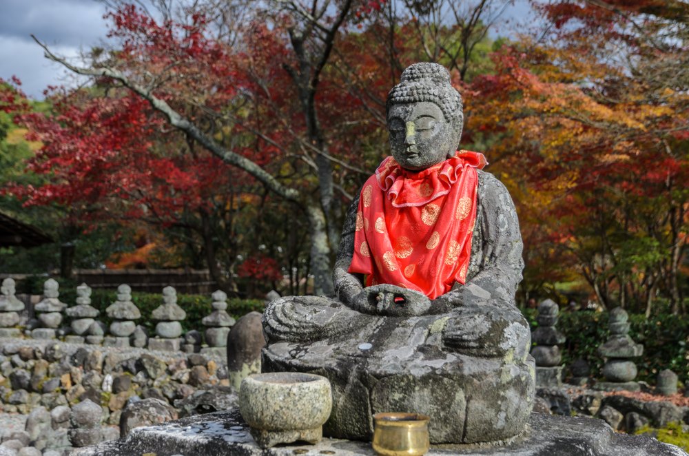 A Buddha statue with a cape in Kyoto, Japan