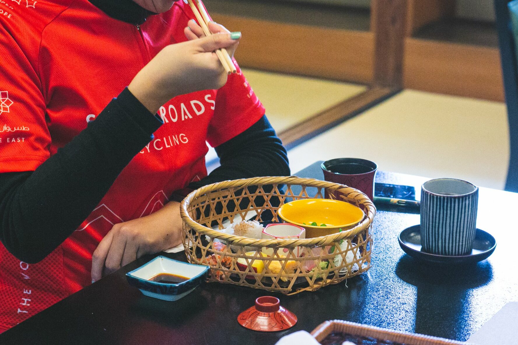 A bike rider eating a traditional breakfast in Kyoto, Japan