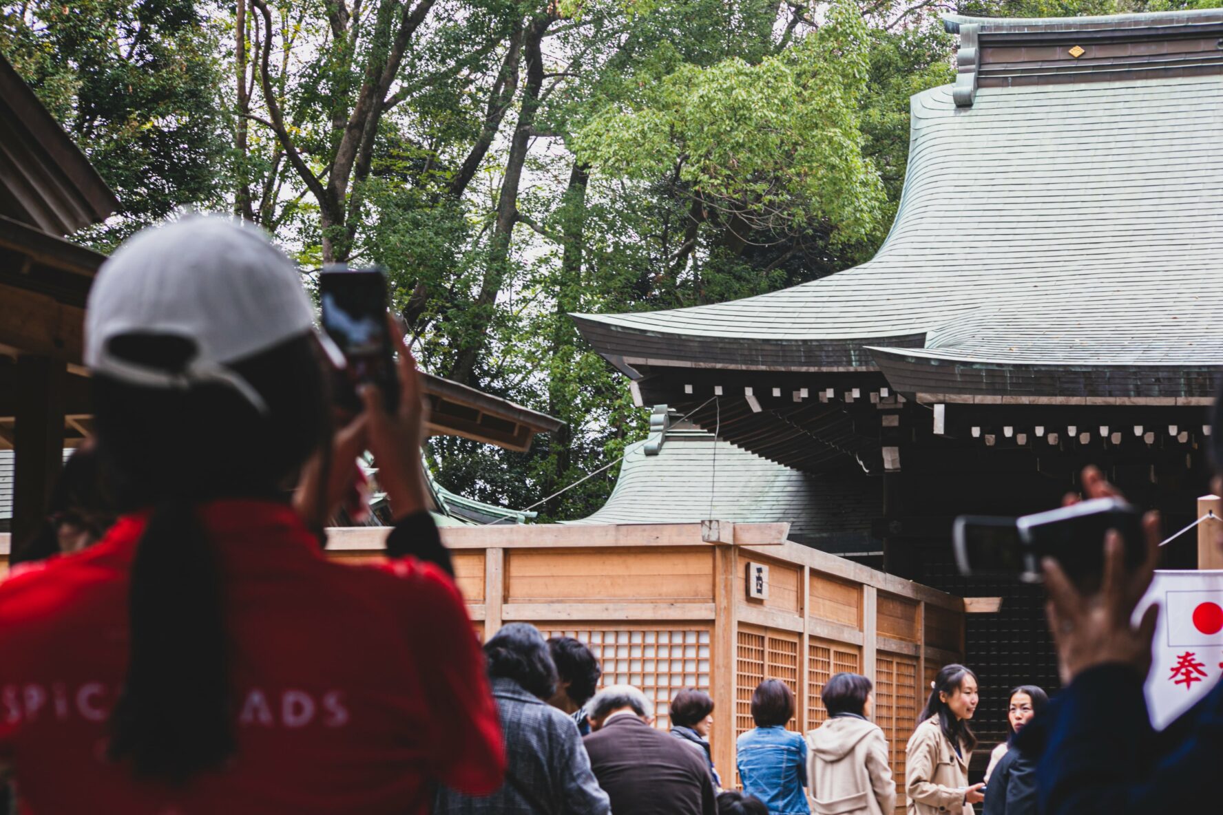 A bike rider taking a photo of a temple near Kyoto, Japan